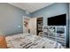 Well-lit bedroom includes a spacious closet, organized storage, and a wall-mounted television for entertainment at 76 Summer Rhapsody Ave, Henderson, NV 89015