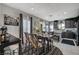 Dining room featuring an elegant table setting, modern chairs, and stylish accents at 76 Summer Rhapsody Ave, Henderson, NV 89015