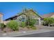 Beautiful home exterior with desert landscaping, a brick driveway and a welcoming curb appeal at 76 Summer Rhapsody Ave, Henderson, NV 89015