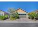 Charming home with desert landscaping, a brick driveway, and a well-maintained facade at 76 Summer Rhapsody Ave, Henderson, NV 89015