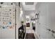 Well-lit hallway featuring stylish decor, wood-look floors, and access to the room and bathroom at 76 Summer Rhapsody Ave, Henderson, NV 89015