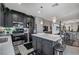 Modern kitchen featuring stainless appliances, central island, and dark wood cabinetry at 76 Summer Rhapsody Ave, Henderson, NV 89015