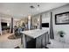 Stylish kitchen showcasing an island, modern pendant lights, and open layout to dining area at 76 Summer Rhapsody Ave, Henderson, NV 89015