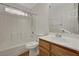 Bathroom with a shower-tub combo, single sink vanity, and tile flooring at 8040 Tailwind Ave, Las Vegas, NV 89131