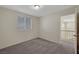 Bedroom featuring neutral carpeting and a large window for natural light at 8040 Tailwind Ave, Las Vegas, NV 89131