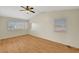Bright bedroom with hardwood flooring and multiple windows at 8040 Tailwind Ave, Las Vegas, NV 89131