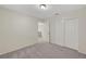 Neutral bedroom featuring a double door closet and carpet flooring at 8040 Tailwind Ave, Las Vegas, NV 89131