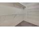 Walk-in closet with carpet flooring and wire shelving for storage at 8040 Tailwind Ave, Las Vegas, NV 89131
