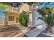 Charming front yard with a well-maintained lawn, mature trees, and attractive landscaping, enhancing the home's curb appeal at 8040 Tailwind Ave, Las Vegas, NV 89131