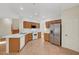 Bright kitchen featuring tile floors, white appliances, and ample cabinet space for storage and meal preparation at 8040 Tailwind Ave, Las Vegas, NV 89131