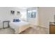 Cozy bedroom with a large window and white curtains providing lots of natural light at 8092 Haywood Estate Ave, Las Vegas, NV 89113