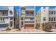 Modern three-story home featuring a brick driveway, balcony, and roof deck at 8092 Haywood Estate Ave, Las Vegas, NV 89113