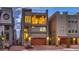 Contemporary three-story home features a balcony, rooftop deck, two-car garage, and neutral exterior paint at 8092 Haywood Estate Ave, Las Vegas, NV 89113