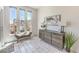 Bright and airy foyer featuring modern decor, tiled floors, and large windows, creating a welcoming entrance at 8092 Haywood Estate Ave, Las Vegas, NV 89113