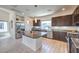 Modern kitchen with stainless steel appliances, granite countertops, and a center island perfect for meal preparation and entertaining at 8092 Haywood Estate Ave, Las Vegas, NV 89113