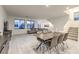Spacious living room featuring ceramic tile floors, large windows for ample natural light, and modern decor at 8092 Haywood Estate Ave, Las Vegas, NV 89113