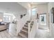 Bright and open-concept living room featuring tile floors and stairway with natural light at 8092 Haywood Estate Ave, Las Vegas, NV 89113