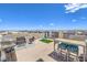 Rooftop terrace featuring outdoor seating, a grill, and a high-top dining table with city views at 8092 Haywood Estate Ave, Las Vegas, NV 89113