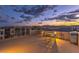 This spacious rooftop deck features comfortable seating and a grill, perfect for outdoor entertaining with sunset views at 8092 Haywood Estate Ave, Las Vegas, NV 89113