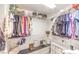 Organized walk-in closet with shelving, hanging rods, and built-in storage for a neat and stylish space at 8092 Haywood Estate Ave, Las Vegas, NV 89113