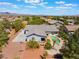 Aerial view of a well-maintained property with a pool, lush landscaping, and a spacious backyard oasis at 8125 Soledad Canyon St, Las Vegas, NV 89131
