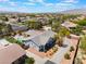 Aerial view showcasing desert landscaping, backyard pool and nearby homes at 8125 Soledad Canyon St, Las Vegas, NV 89131