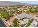 Lovely backyard with pool, tiki bar and covered patio perfect for outdoor entertaining at 8125 Soledad Canyon St, Las Vegas, NV 89131