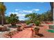 Inviting backyard features a relaxing hammock, lush plants, and a charming brick-paved patio area at 8125 Soledad Canyon St, Las Vegas, NV 89131