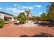Spacious backyard featuring a hammock, desert landscaping, patio, and lush tropical plants, perfect for relaxation at 8125 Soledad Canyon St, Las Vegas, NV 89131