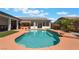 A backyard pool featuring tropical accents and covered patios at 8125 Soledad Canyon St, Las Vegas, NV 89131