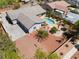 Stunning backyard with a refreshing pool, covered patio, tiki bar and a flag pole at 8125 Soledad Canyon St, Las Vegas, NV 89131