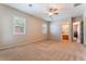 Bedroom featuring neutral walls, carpet floors, and a view to the bathroom at 8125 Soledad Canyon St, Las Vegas, NV 89131