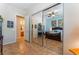 Bedroom featuring tile floors, neutral walls, and a mirrored closet, offering a bright and spacious atmosphere at 8125 Soledad Canyon St, Las Vegas, NV 89131
