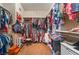 This walk-in closet is large with racks and storage shelves along each side of the wall at 8125 Soledad Canyon St, Las Vegas, NV 89131