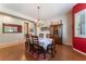 Formal dining room showcasing a chandelier and view through to other rooms at 8125 Soledad Canyon St, Las Vegas, NV 89131