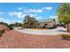 Wide circular driveway leads to a charming single-story house with a desert landscaped yard at 8125 Soledad Canyon St, Las Vegas, NV 89131