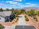 Exterior view featuring a circular driveway and desert landscaping at 8125 Soledad Canyon St, Las Vegas, NV 89131