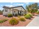 Inviting home exterior with colorful landscaping, a well-manicured lawn, and charming curb appeal at 8125 Soledad Canyon St, Las Vegas, NV 89131