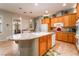 Open concept kitchen with a large island and breakfast bar at 8125 Soledad Canyon St, Las Vegas, NV 89131