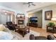 Spacious living room featuring a fireplace, media center, and seamlessly connecting to the kitchen at 8125 Soledad Canyon St, Las Vegas, NV 89131