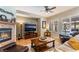 Cozy living room with a fireplace, media center, and ample seating for relaxation and entertainment at 8125 Soledad Canyon St, Las Vegas, NV 89131
