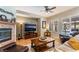 Cozy living room with a fireplace, media center, and ample seating for relaxation and entertainment at 8125 Soledad Canyon St, Las Vegas, NV 89131
