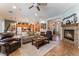Expansive living area connects fireplace, media, kitchen, and seating for open-concept living at 8125 Soledad Canyon St, Las Vegas, NV 89131