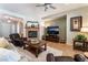 Spacious living room featuring a fireplace, media center, and seamlessly connecting to the kitchen at 8125 Soledad Canyon St, Las Vegas, NV 89131