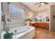 This spacious bathroom features a garden tub with natural lighting and a large vanity at 8125 Soledad Canyon St, Las Vegas, NV 89131