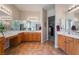 The main bath has tile floors, dual sinks, a vanity area, and large mirrors above the sinks at 8125 Soledad Canyon St, Las Vegas, NV 89131