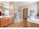 This bathroom features a garden tub, shower with glass surround, and spacious vanity at 8125 Soledad Canyon St, Las Vegas, NV 89131
