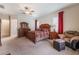 The large main bedroom has an attached sitting area, carpet, and a large window to the yard at 8125 Soledad Canyon St, Las Vegas, NV 89131