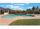 Backyard pool with tropical accents and waterfall feature at 8125 Soledad Canyon St, Las Vegas, NV 89131