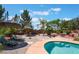 Backyard pool with lounge seating and tropical accents at 8125 Soledad Canyon St, Las Vegas, NV 89131